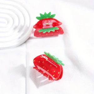 Cute red strawberry hair claws made of acrylic for sweet fruit style hair styling