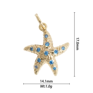 Detailed size view of a gold starfish charm with blue cubic zirconia stones