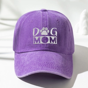 Close-up of DOG MOM embroidery and paw print on washed cotton purple baseball cap