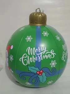 Detail of green PVC inflatable Christmas ball with blue stripes and snowflake patterns