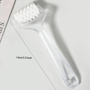 Detail view of a 14cm manual scalp massager roller with spikes for meridian therapy