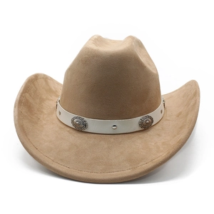 Macro shot of faux suede cowboy hat with vintage floral silver buckles and white leather band