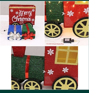 Detail of light-up Christmas train with sequins and 110-240V power adapter