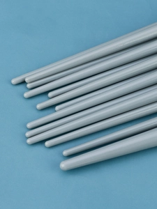 Detail of the smooth grey circular handles of the 13-piece eye makeup brush set
