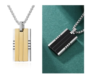 Detail of rectangular titanium steel pendant with brushed gold and black finish highlights