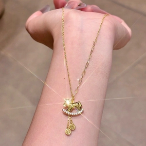 Gold rocking horse necklace with zircon stones and mixed chain design for women