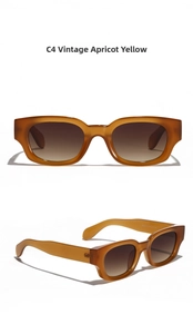 Close-up of Retro Apricot Yellow cat eye sunglasses with dark brown gradient lenses