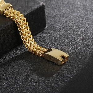 Detail of gold double-row dragon scale chain with a square magnetic metal buckle