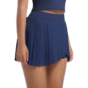 Detail view of high-waisted navy blue pleated tennis skort with moisture-wicking fabric