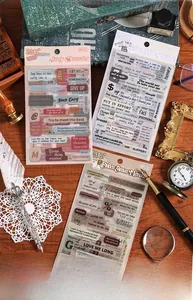 Macro view of vintage style waterproof PET stickers featuring artistic English phrases