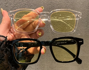 Detail view of square sunglasses frames with size specifications 50-21-148 on inner arm
