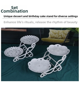 Detail of white lace-edged tiered cupcake stand set with double-layer display design
