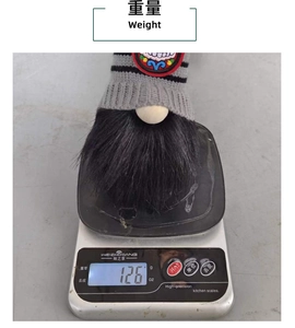 Detail showing a Halloween skull gnome plush being weighed at 126g on a digital scale
