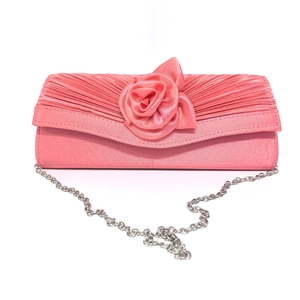 Pink satin evening clutch featuring pleated fabric and a detailed 3D rose decoration