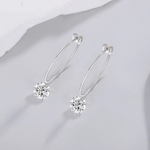 Detailed view of S925 sterling silver hoop earrings with round sparkling moissanite stone