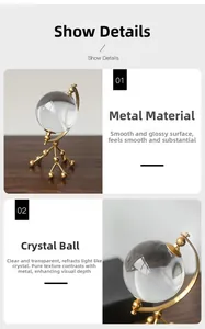 Detail of crystal globe ornament with electroplated golden metal stand for luxury decor