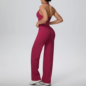 Detail view of deep berry yoga set featuring a halter neck top and high-waist wide-leg pants
