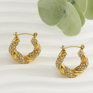 18K gold-plated stainless steel twisted hoop earrings with crystals on a white background