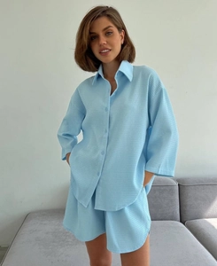 Detail of light blue waffle knit fabric on long-sleeved shirt and high-waist shorts set
