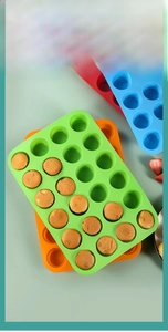 Macro detail of flexible 24-cup silicone muffin pan in multiple vibrant colors