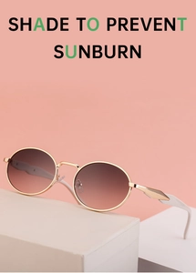 Detail of retro oval gold frames with tea-pink gradient lenses and white temple tips