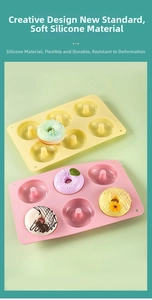 Close-up of 6-cavity silicone donut baking mold in pink and yellow flexible material
