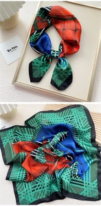 Detail of a square silk scarf with vintage geometric patterns in green, orange, and blue