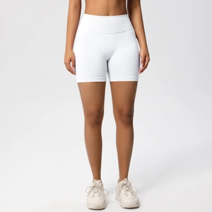 Front view of white seamless high-waisted fitness shorts with wide tummy control waistband