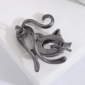 Detailed view of the dark grey metal cat brooch reverse showing the secure pin fastener