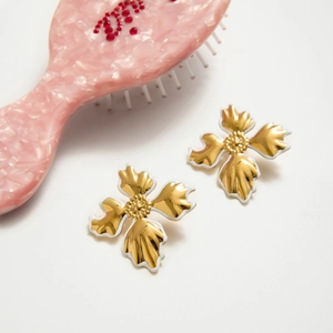 Elegant 18K gold plated stainless steel floral stud earrings with white enamel finish
