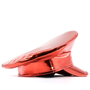 Detail of red holographic patent leather military cap with glossy finish on white background