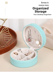 Internal layout of Tiffany blue round PU leather jewelry box showing ring slots and hooks
