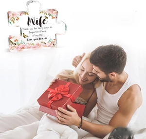 Detail of puzzle-shaped acrylic plaque with floral design and sentimental message for wife