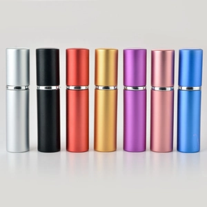 Row of 5ml matte aluminum perfume spray bottles in seven vibrant metallic colors