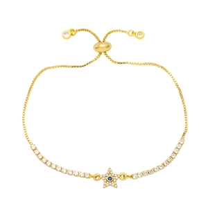 Detail of adjustable gold box chain bracelet with blue zircon star pendant and slider