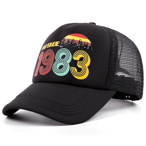 Vintage 1983 print black trucker hat with breathable mesh and retro sunset graphic