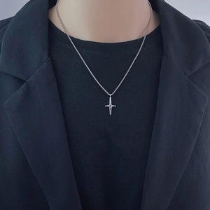 Minimalist silver cross necklace for women featuring an adjustable pendant chain