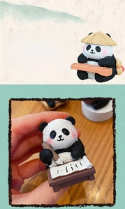 Detail of cute panda resin figurines with miniature Guqin and calligraphy scrolls