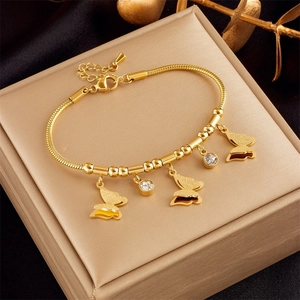 Detailed shot of multi-layer rose gold butterfly pendant bracelet on jewelry gift box