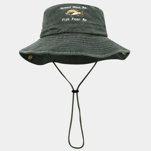 Detail of embroidered fish pattern and funny text on a washed cotton fishing hat