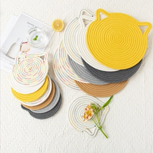 Macro shot of cat-shaped cotton woven coasters in multiple colors with clear textures