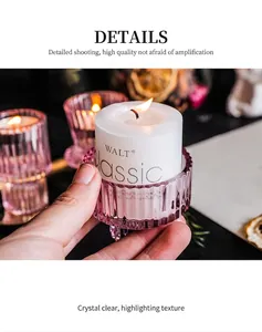 Close-up of pink striped glass candle holder being held to show fine texture