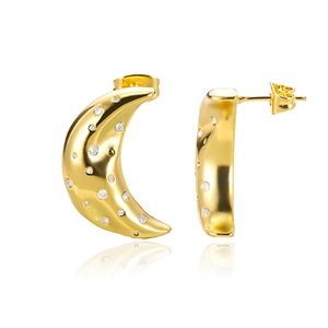 Detail of moon-shaped gold earrings featuring shimmering cubic zirconia pavé setting