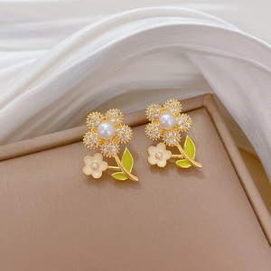 Gold floral stud earrings with pearls, rhinestones and green leaves on silk base