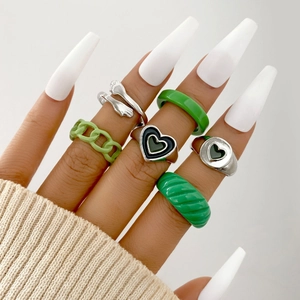 6-piece silver and green heart ring set with chain and hug hands design on hand