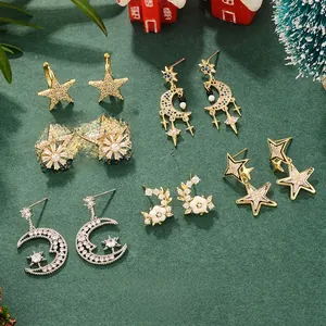 Detailed set of gold-plated star and moon earrings with sparkling zircon for Christmas