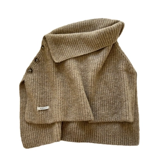 Brown knit high collar poncho with side buttons and ribbed texture for winter wear
