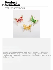 Detailed view of enamel butterfly brooches in red, green, and yellow with alloy finish