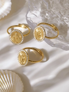 Detail of three 18k gold plated adjustable rings with Virgin Mary relief and white zircons