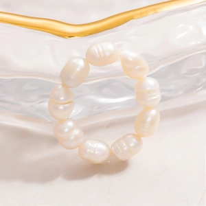 Elegant 18K gold plated stainless steel ring featuring natural freshwater pearls